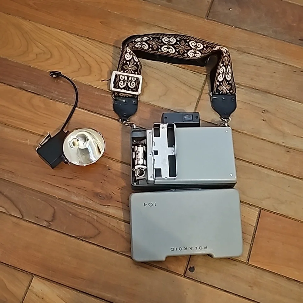 Vintage Polaroid automatic 104 land camera with beautiful strap